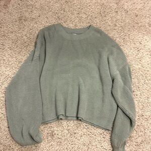 This is a sweater from hollister, size L, and it’s a green color